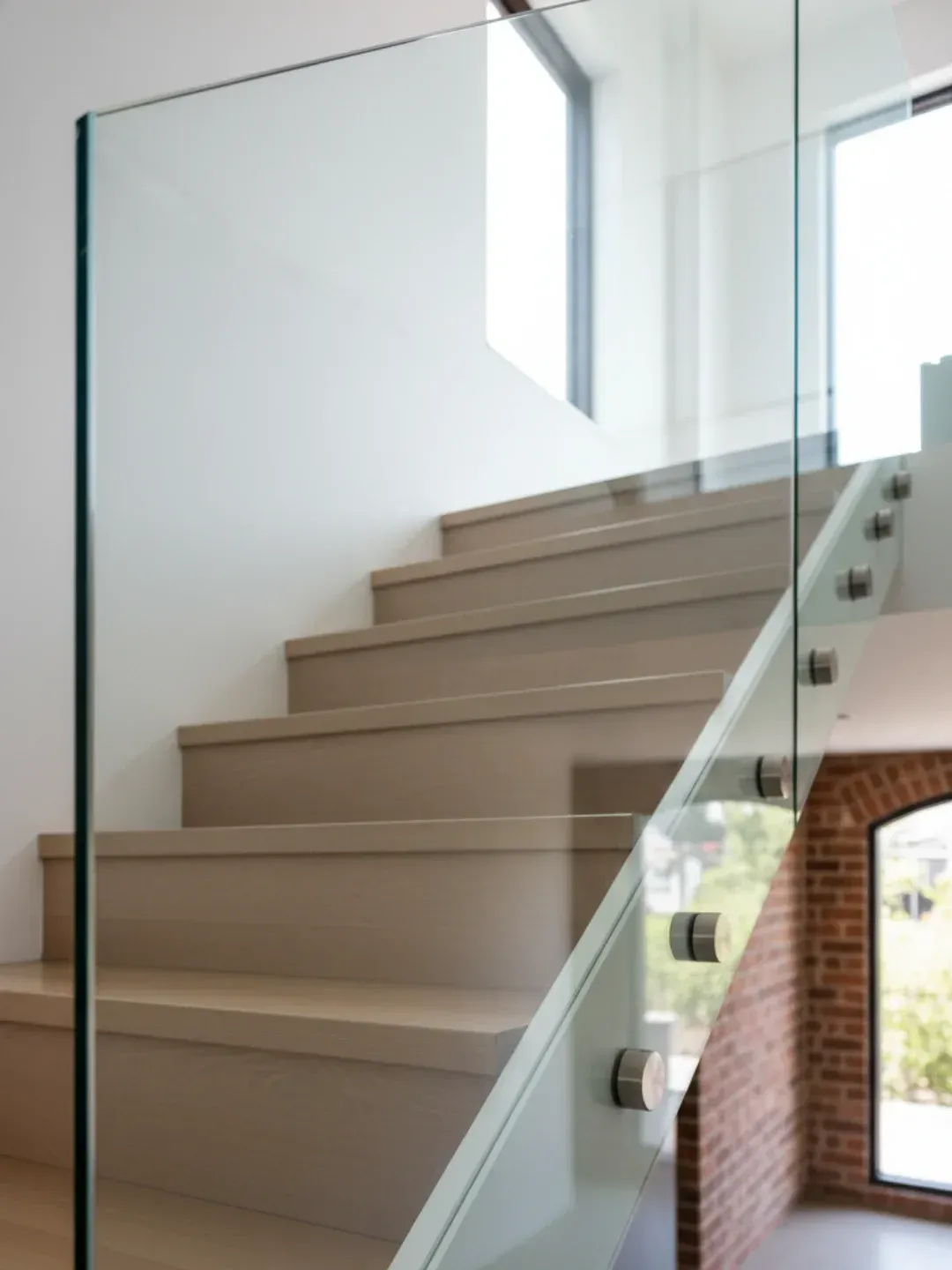 Pin-fixed standoff glass balustrades Teneriffe with floating glass effect using marine grade stainless steel fittings.