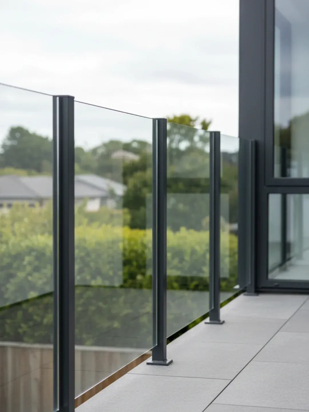 Semi-frameless glass balustrades Teneriffe with powder-coated aluminium posts and glass infill panels for robust compliance.